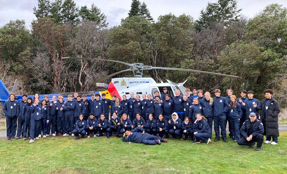 Students posing with RCMP Air Unit Helicopter