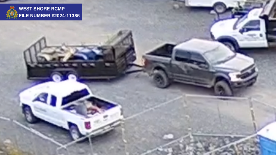 Suspect vehicle towing stolen trailer with quads
