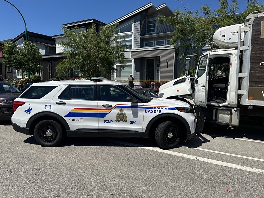 Photograph of the Police car against the stolen 5-tonne truck