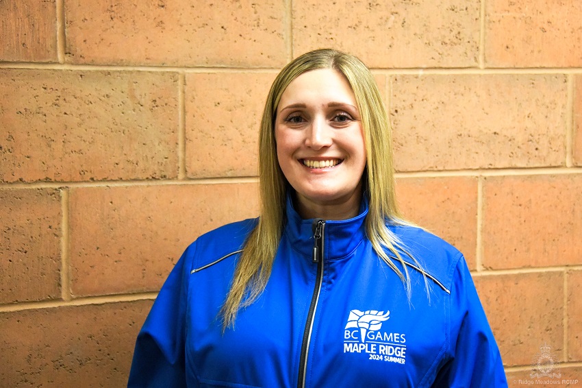 Crime Prevention Supervisor Celina Dominelli wearing a blue jacket with a BC Summer Games 2024 Maple Ridge logo patch