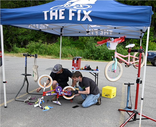Jason Levecque of The Fix Cyclery and Cafe with team of bike mechanics