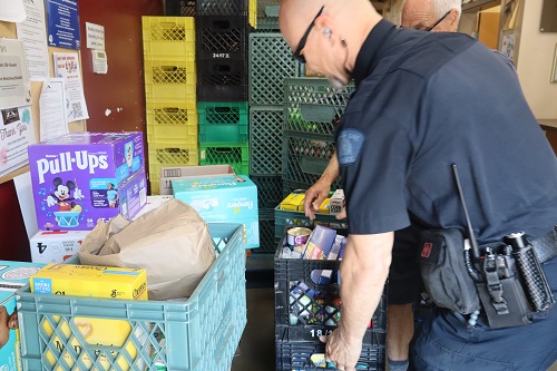Cst. Glen Tjernagel dropping off donations to the SHARE Society