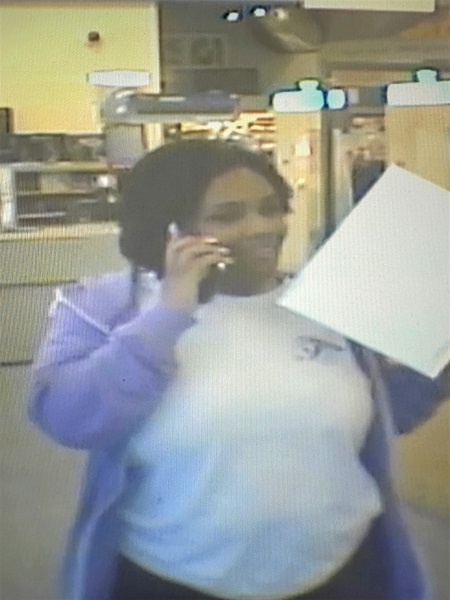 Photo of woman walking out of post office