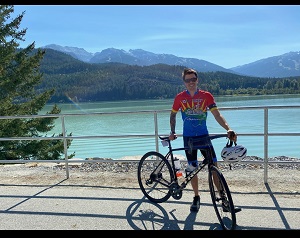 Constable Alex McNulty standing with his cops for cancer bike
