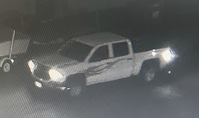 Four-door pick-up truck with flames on the driver&rsquo;s side