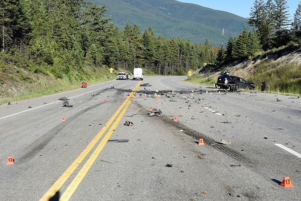 BC Highway Patrol investigators at the scene of a fatal collision that led to six charges against a Cranbrook man.