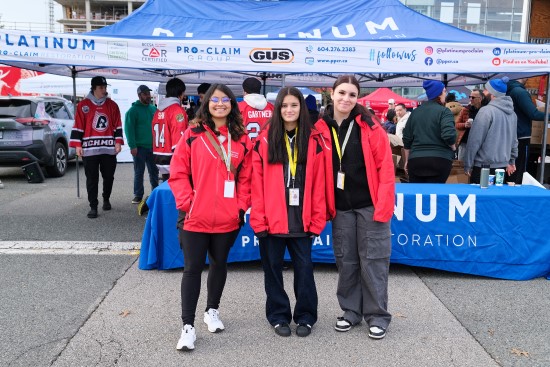 Three volunteers standing together