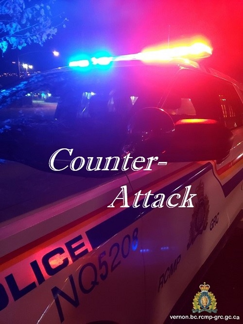 photo of police vehicle with red and blue lights counter attack in text