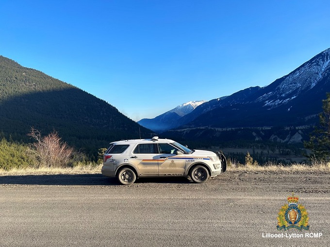 Pictured is an RCMP vehicle with a clear blue sky above during sunset in Lillooet.