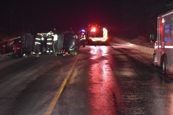 : Emergency responders work at the scene of a fatal collision that killed a 64-year-old woman