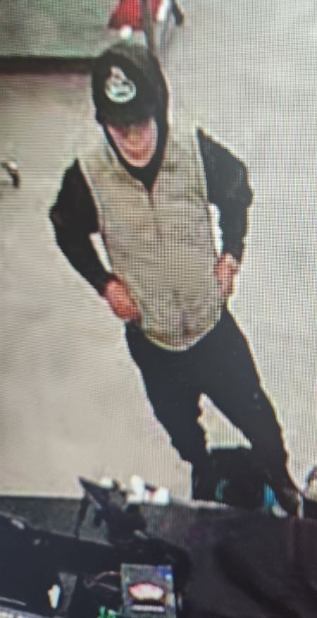 A front facing image of the suspect described. 