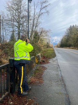 Photo of officer measuring speed