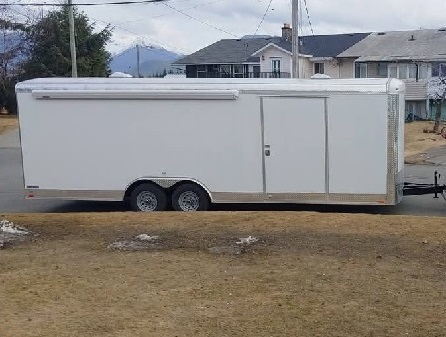 photo of a 2019 white enclosed utility trailer w