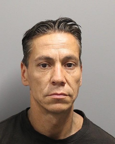 Donald Lee Oker with short brown hair that is greying, wearing a black crew neck shirt