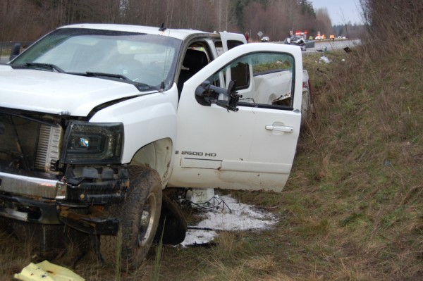 Both vehicles, including this white Chevrolet pickup, were destroyed in the collision