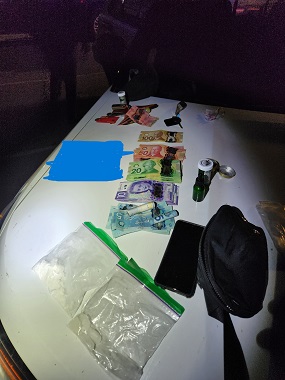 Cash and suspected illicit drugs 