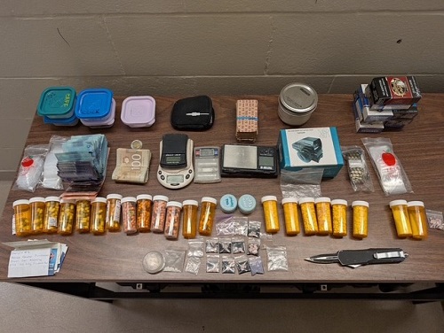 display of seized drugs and pill bottles