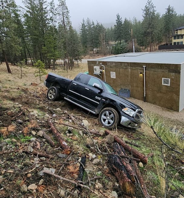 Passenger side of truck on steep bank