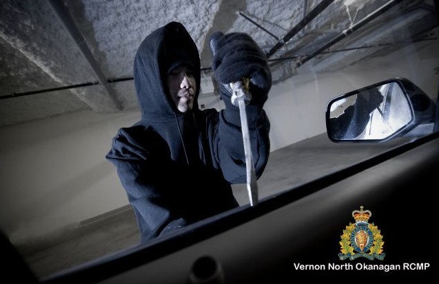 photo of supsect breaking into vehicle