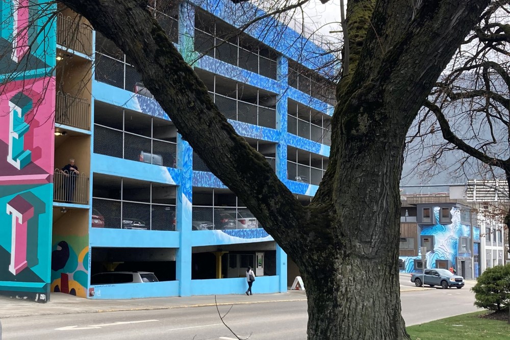 Can you spot the police? A Nelson BC Highway Patrol officer uses the third floor of a parking garage to alert his partners about distracted drivers