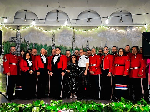 Group photo of RCMP employees and police officers in Red Serge