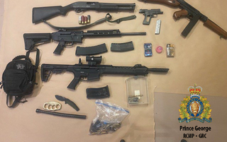 Photo of the weapons and drugs seized by police officers