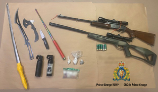 Photo of the seized guns and drugs