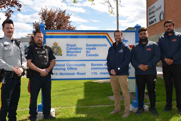 Photo of Cpl. Gauthier beside representatives from Bylaw Services, City of Kelowna and the Uptown Rutland Business Association