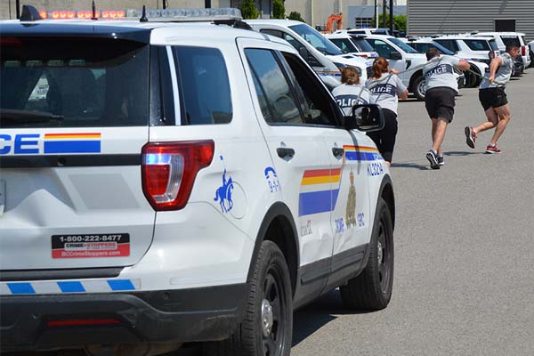 Team RCMP pulling police car