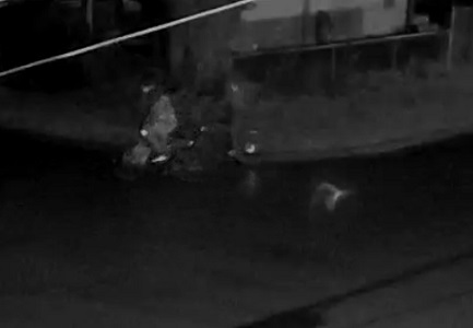 Side view of unknown individual on bike