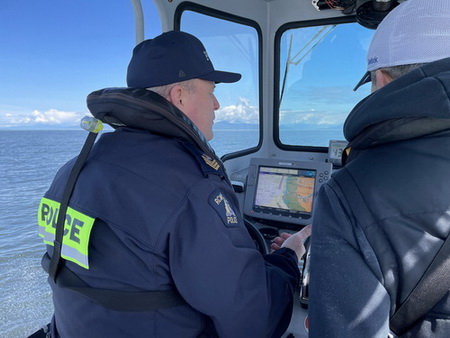 Photo of SSM Lundie captaining the Richmond RCMP Fraser Guardian