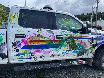 side view of RCMP Marked police truck pained colorfully while at Haisla Days