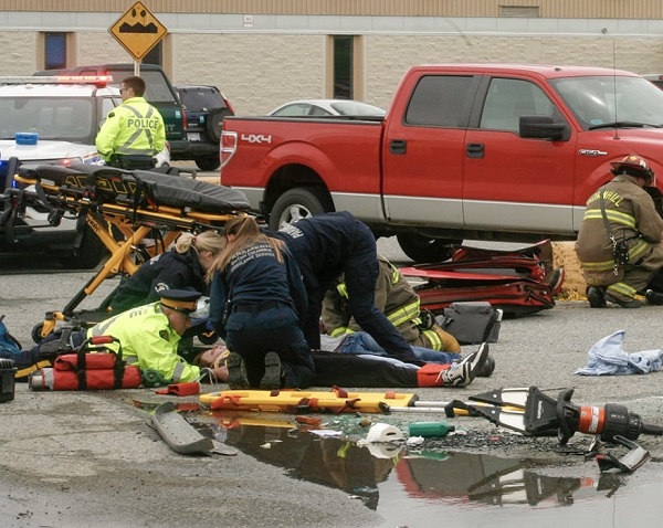 Terrace and Thornhill Firefighters, along with BC Highway Patrol and Emergency Health Services, treat a student acting as a victim in a mock collision