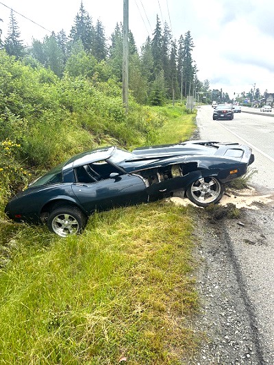 Photo of Corvette in ditch