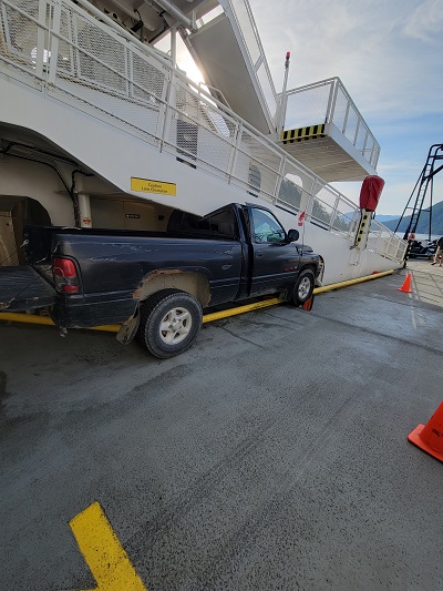 black pick up truck wedged into a BC Ferries galley ramp