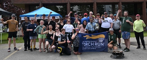 Torch run participants gather for photo