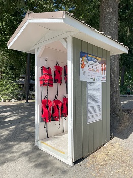 Kids Don&rsquo;t Float life jacket loaner station stocked with various sizes of life jackets