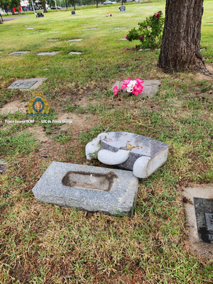 to of a headstone that was knocked over