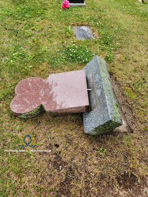 to of a headstone that was knocked over