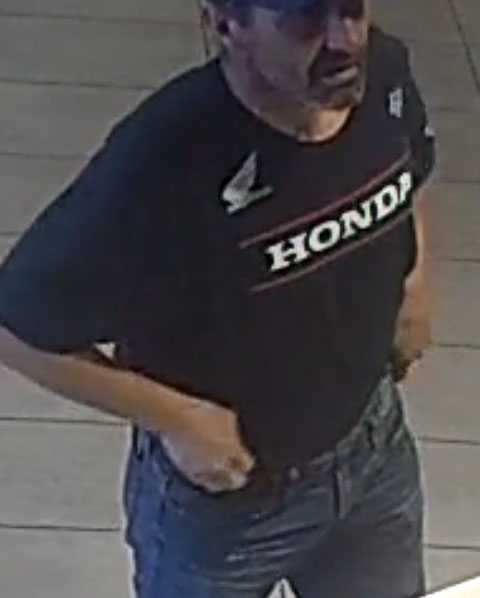 suspect in black t-shirt with HONDA on the front