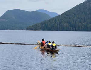 Cedar dugout canoe in the water at Mowat Bay