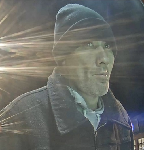 photo of witness with stubbly facial hair wearing a blue toque and blue zip up collared coat