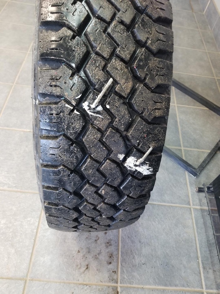 Photo 1 of nail in tire