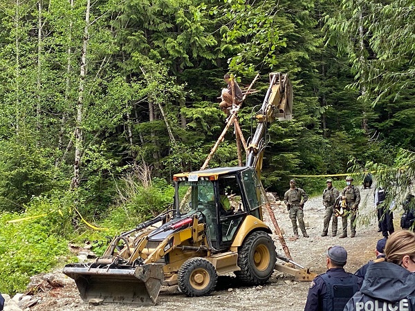 Photo 1 of individual on tripod structure