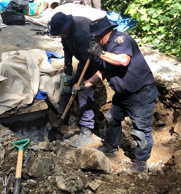 Photo of extraction efforts to remove individuals from locking devices 