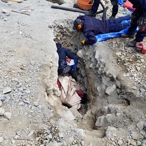 protesters & rcmp members  in trench