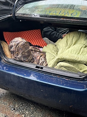 Photo of individual inside vehicle