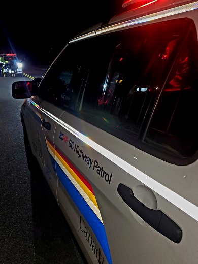 Night time view from rear-driver&rsquo;s side of marked RCMP vehicle displaying BC Highway Patrol