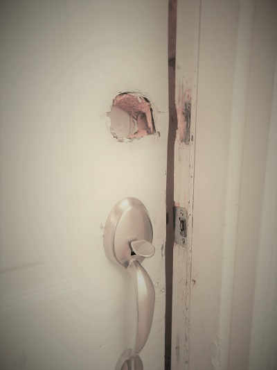 Photo of broken entry door