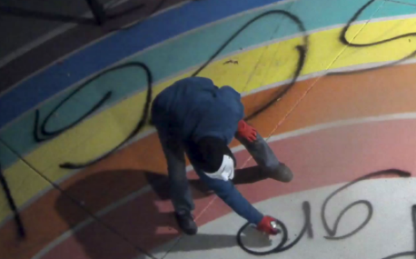 suspect  spray paining raninbow art